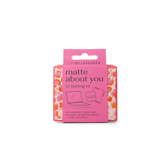 Pink oil blotting kit packaging with 'matte about you' text on a white background