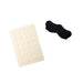Sheet of beige adhesive dots with a black sock on a white background