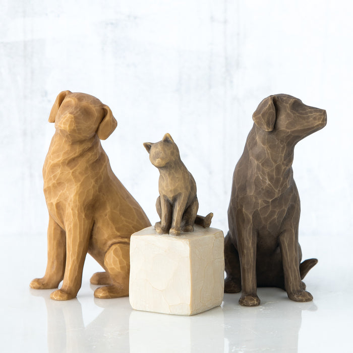 Three brown dog statues on a white background
