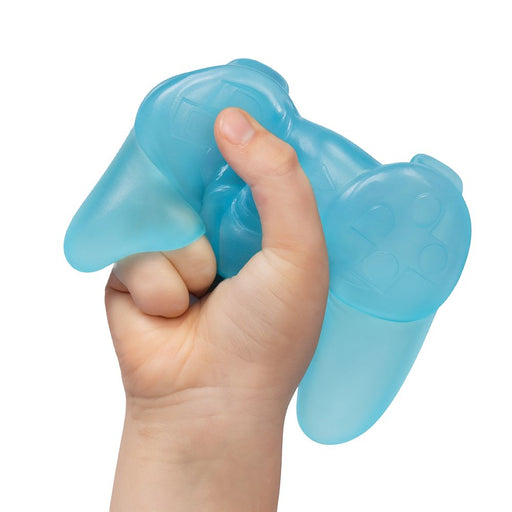 Hand holding a blue silicone dog toy on a white background