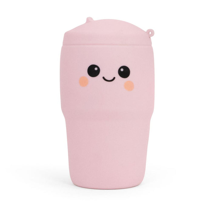 Pink plush toy with a smiling face on a white background
