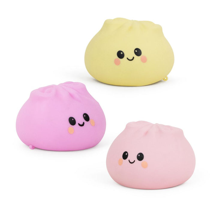 Three dumpling-shaped toys on a white background