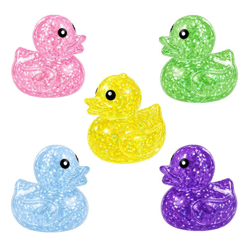 Different colored ducks on a white background