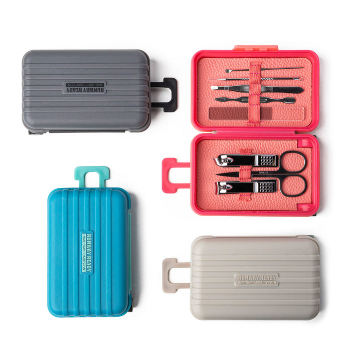 Set of manicure tools in a pink case with four different colored cases on a white background.