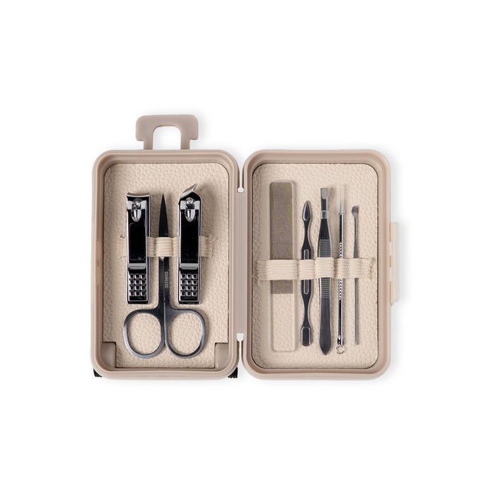 Manicure set with tools in a beige case on a white background