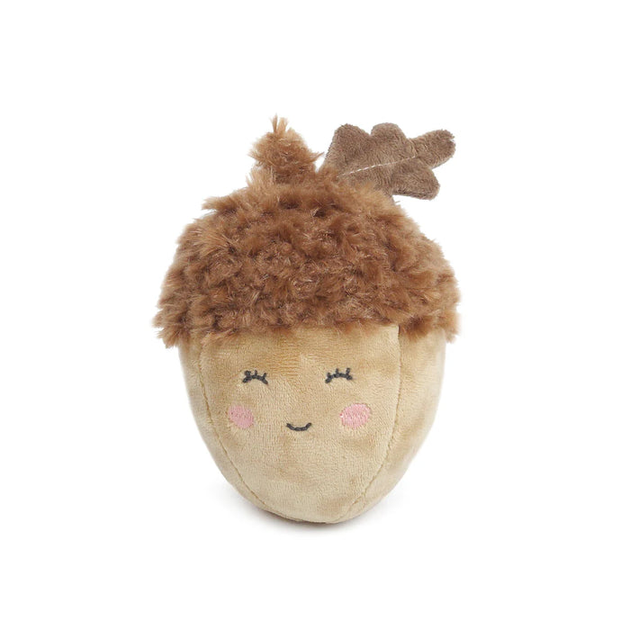 Plush acorn toy with a face on a white background