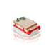 Small decorative sled with a red runner and holly leaves on a white background