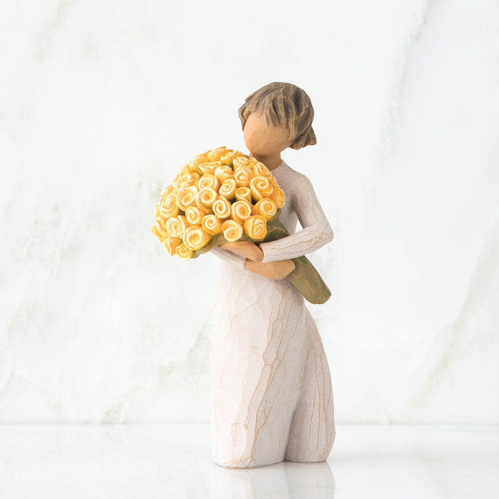 Statue of a person holding a large bouquet of yellow flowers on a white background