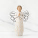 Standing angel in cream dress with wire wings, with hands in prayer position; tree carving on angel's dress