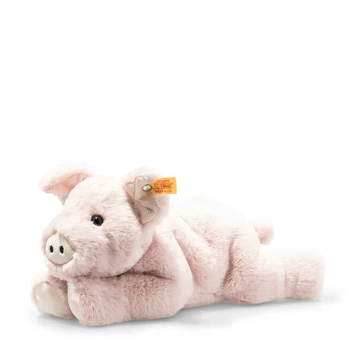 Plush pig toy with a visible brand tag on a white background