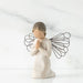 Angel figurine with wire wings on a white background