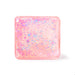 A square pink resin plaque or coaster with rounded corners, filled with iridescent glitter in shades of blue, purple, and gold, shown on a clean white background.