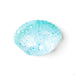 A light blue glittery seashell-shaped container or bowl, photographed on a clean white background.