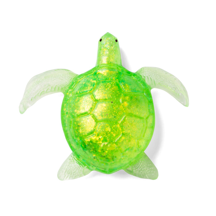 A translucent green sea turtle toy with a glittery yellow-green shell, isolated on a white background.