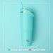 Turquoise tumbler with straw on a light blue background, featuring the Swig brand.