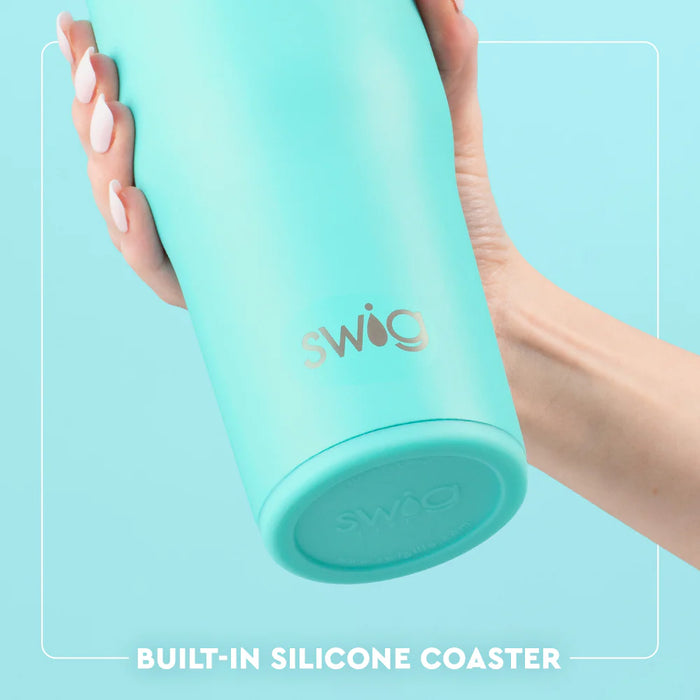 Turquoise Swig tumbler held by a hand with a light blue background
