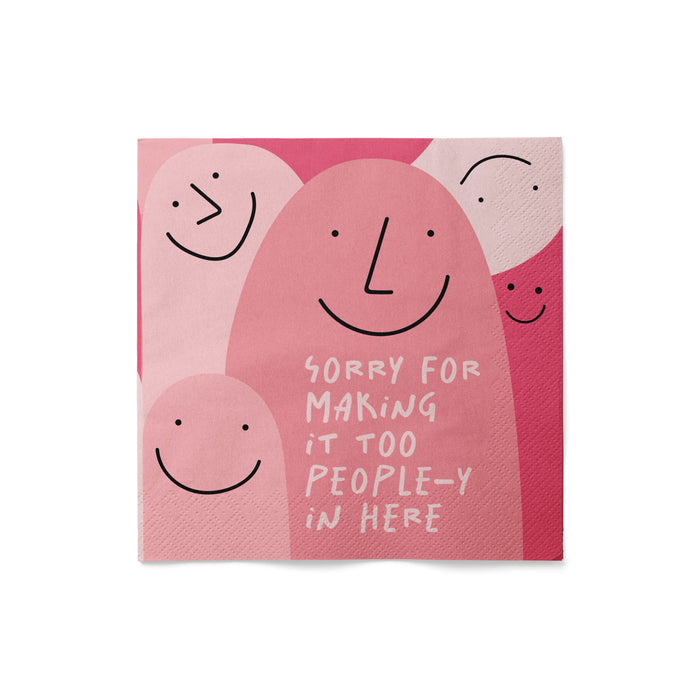 Napkin with smiley faces and text on a pink background