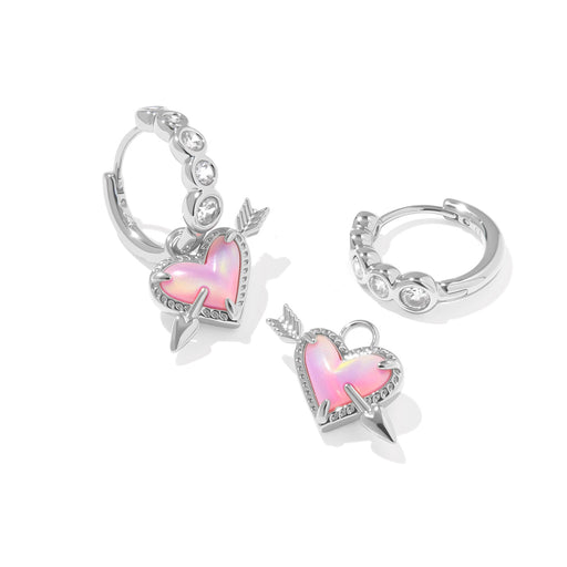 Silver hoop earrings with pink heart charms on a white background