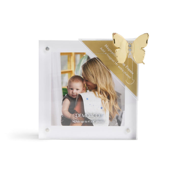 White photo frame with gold butterfly design on a white background