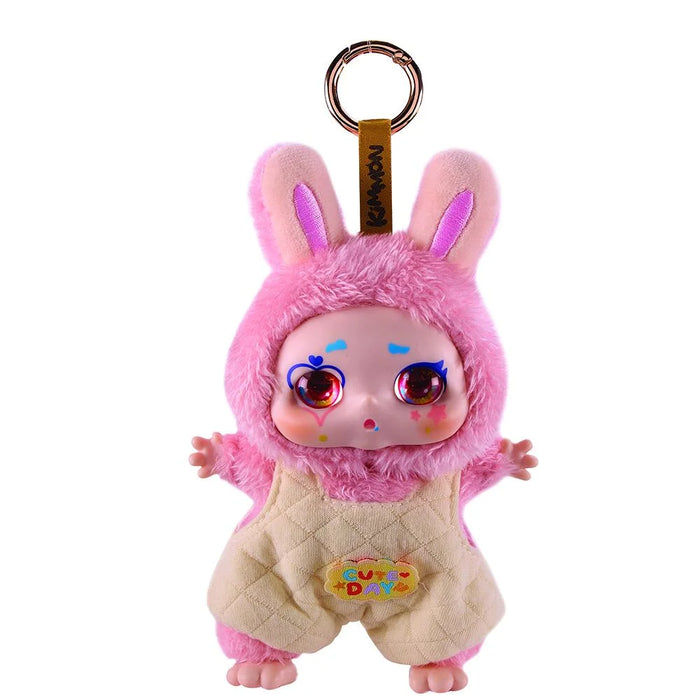 Plush toy keychain with pink bunny ears and face on a white background