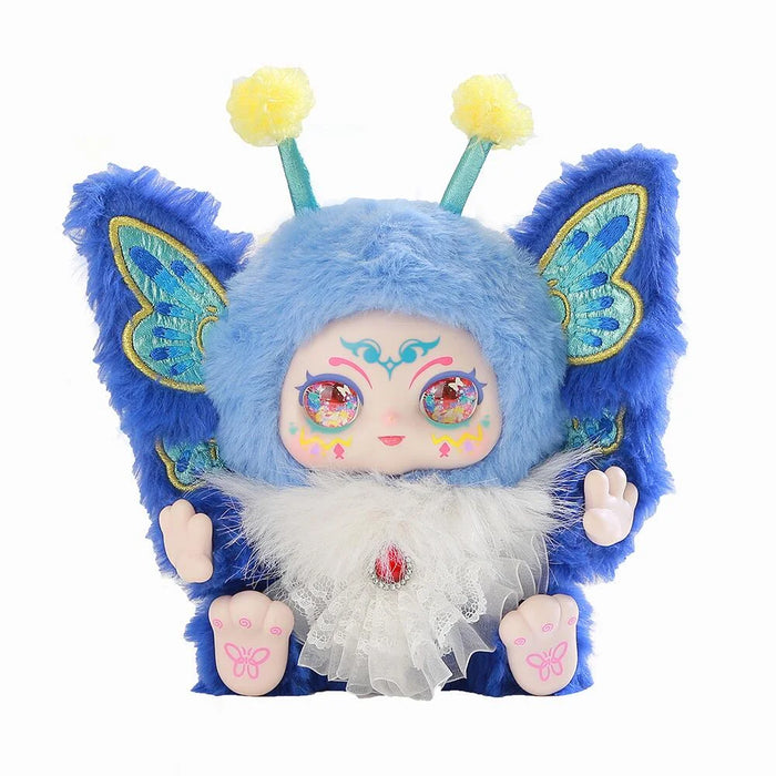 Blue plush toy with butterfly wings and decorative elements on a white background