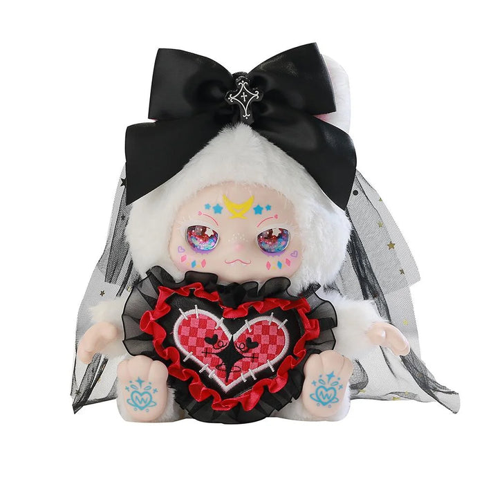 Toy doll with white hair, black bow, and red heart emblem on a white background
