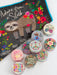Decorative items with motivational phrases and a sloth design on a colorful background