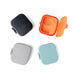 Four colorful compact cases on a white background