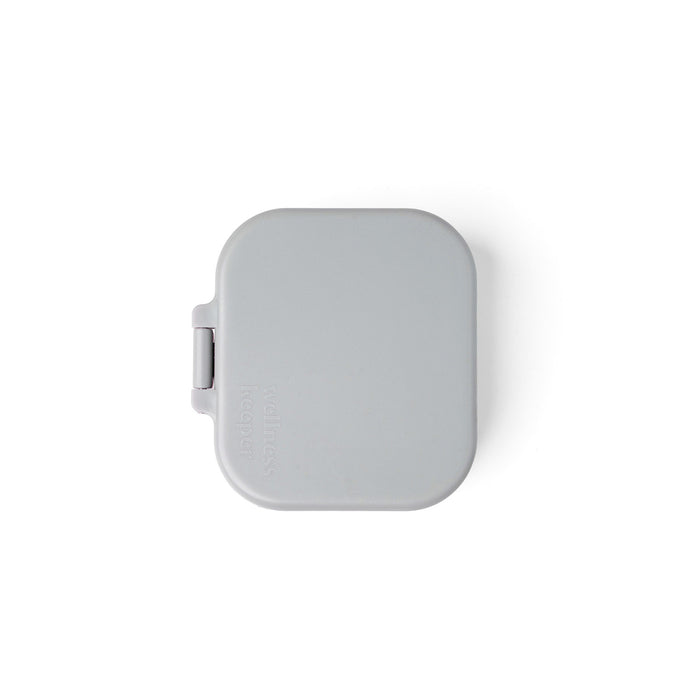 Square gray compact mirror on a white background