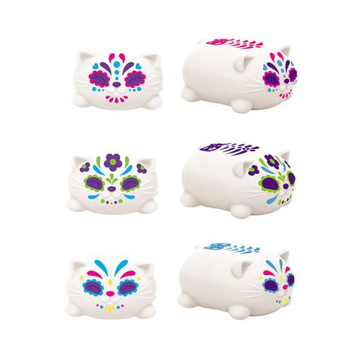 Set of six white cat-shaped containers with colorful designs on a white background